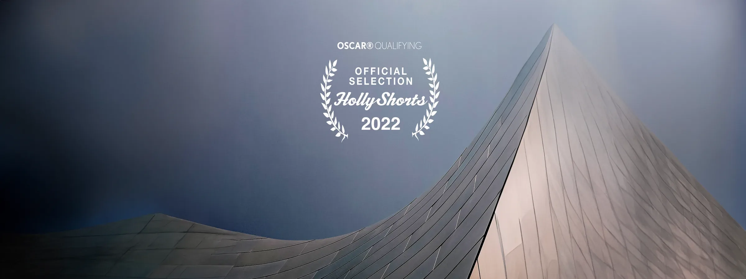 The official selection laurel on a second architectural image.