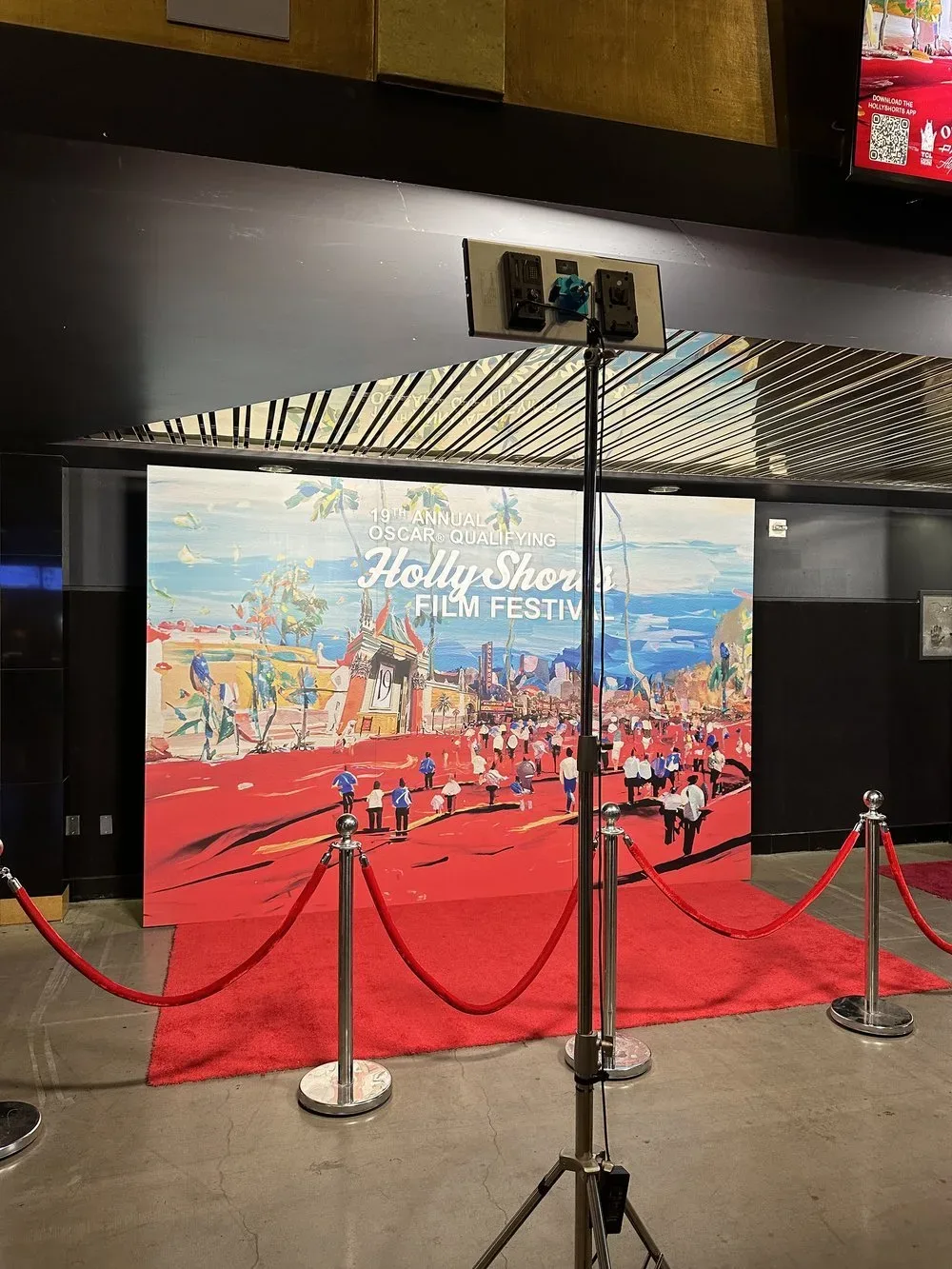 The painted backdrop set up in the theater lobby.