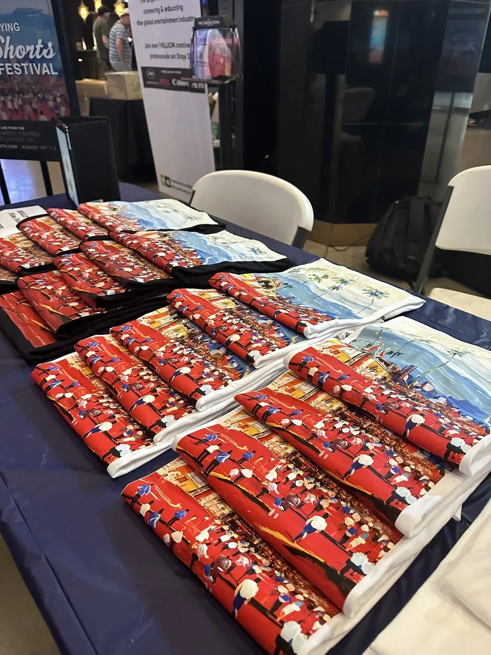 Printed festival materials laid out on a table.