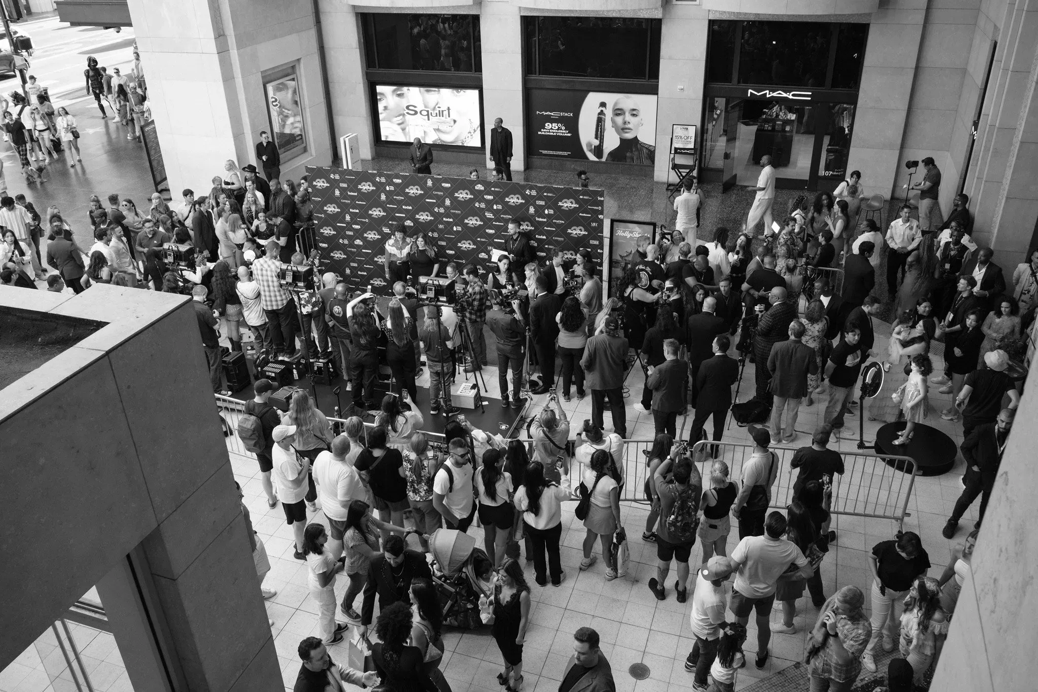 The festival crowd seen from above, in black and white.