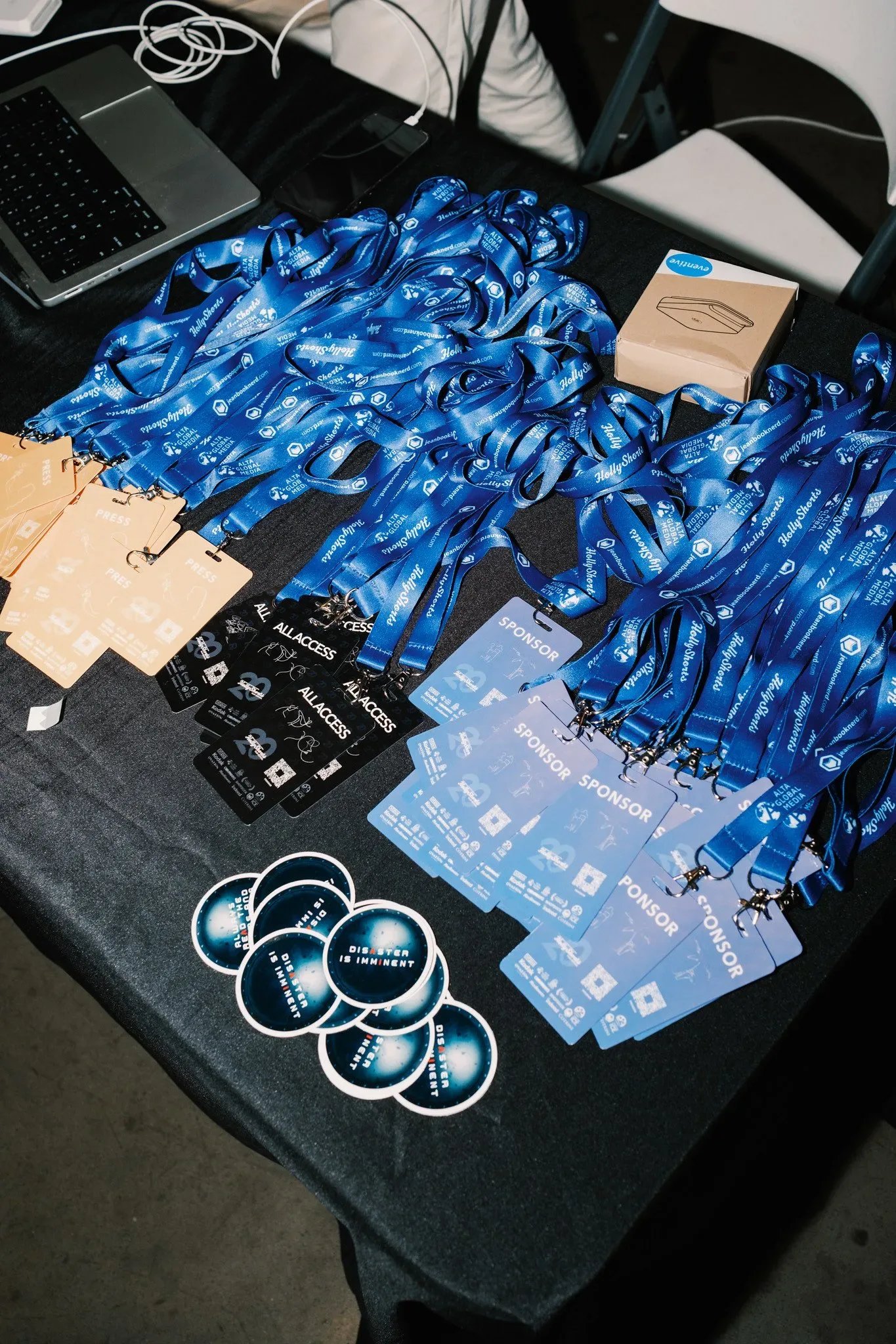 Badge Designs: badges and lanyards on a table