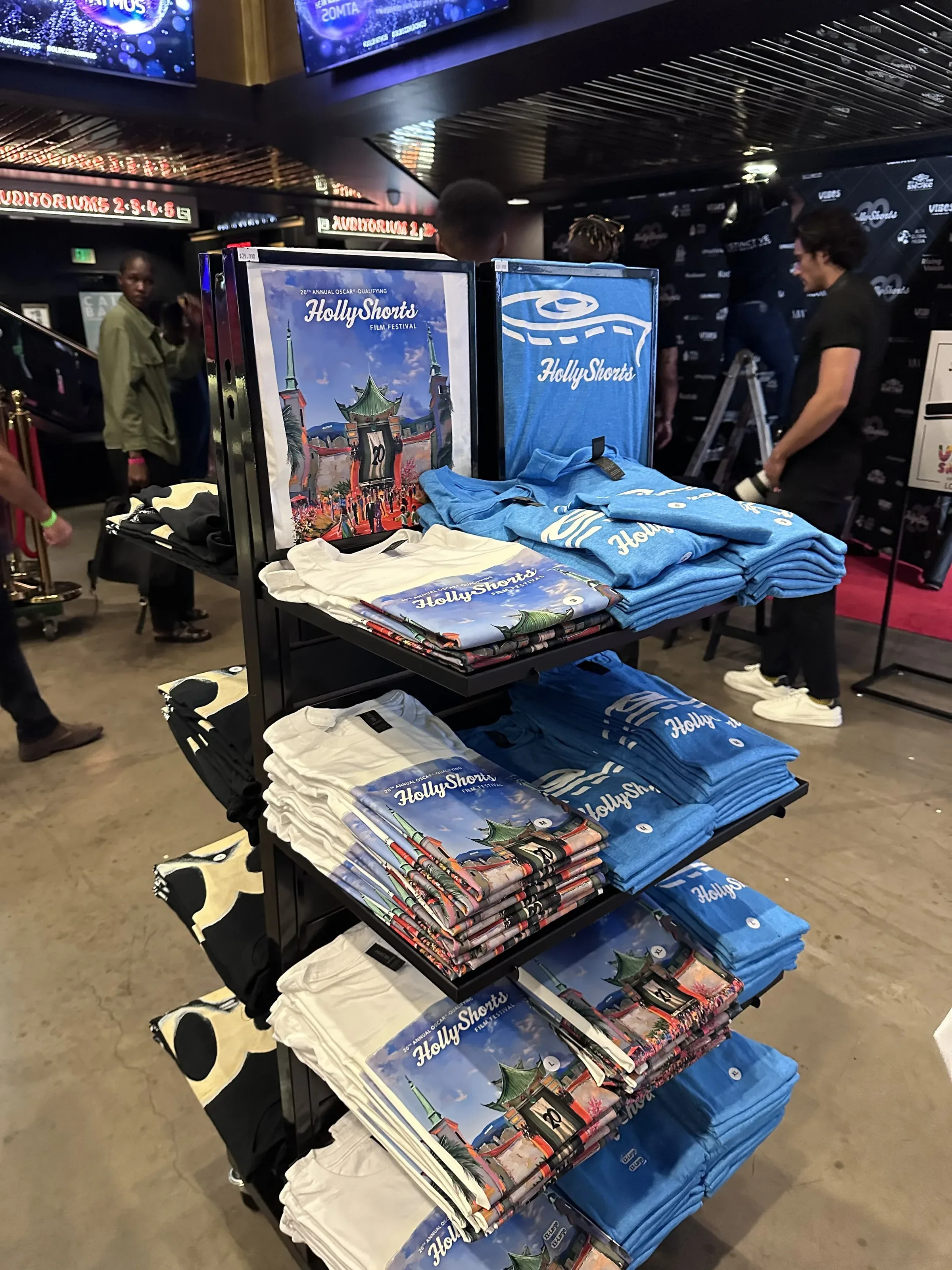 Merch Designs: merch display with t-shirts