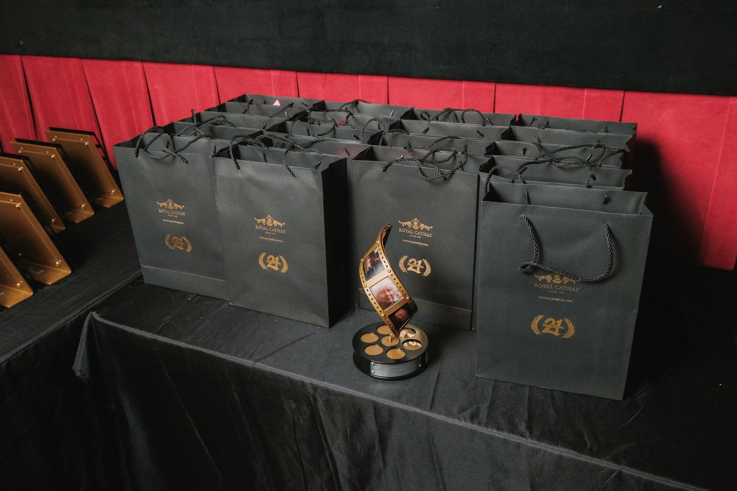 Awards and gift bags laid out on a table.