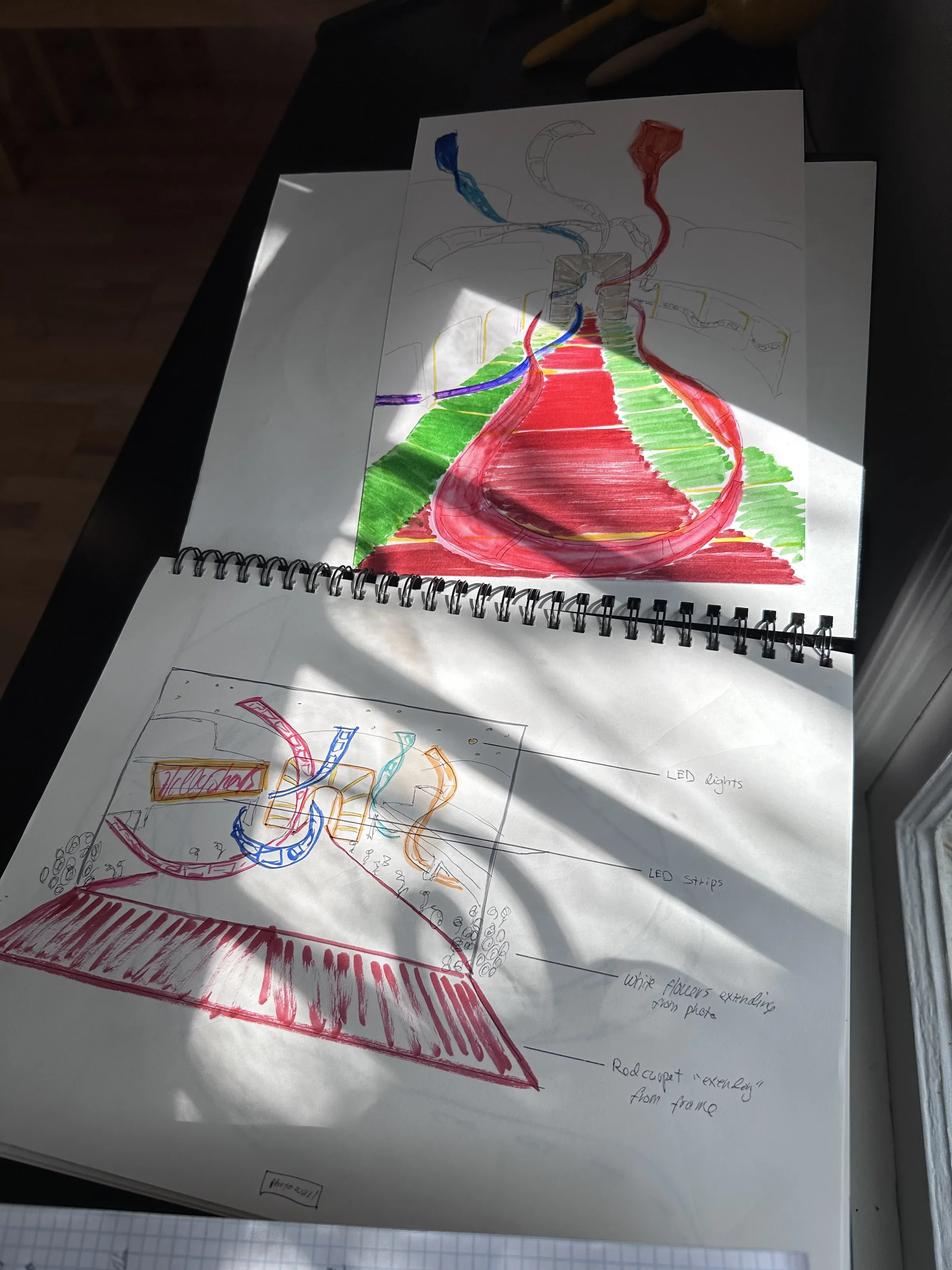 A sketchbook spread of color studies and concept drawings.
