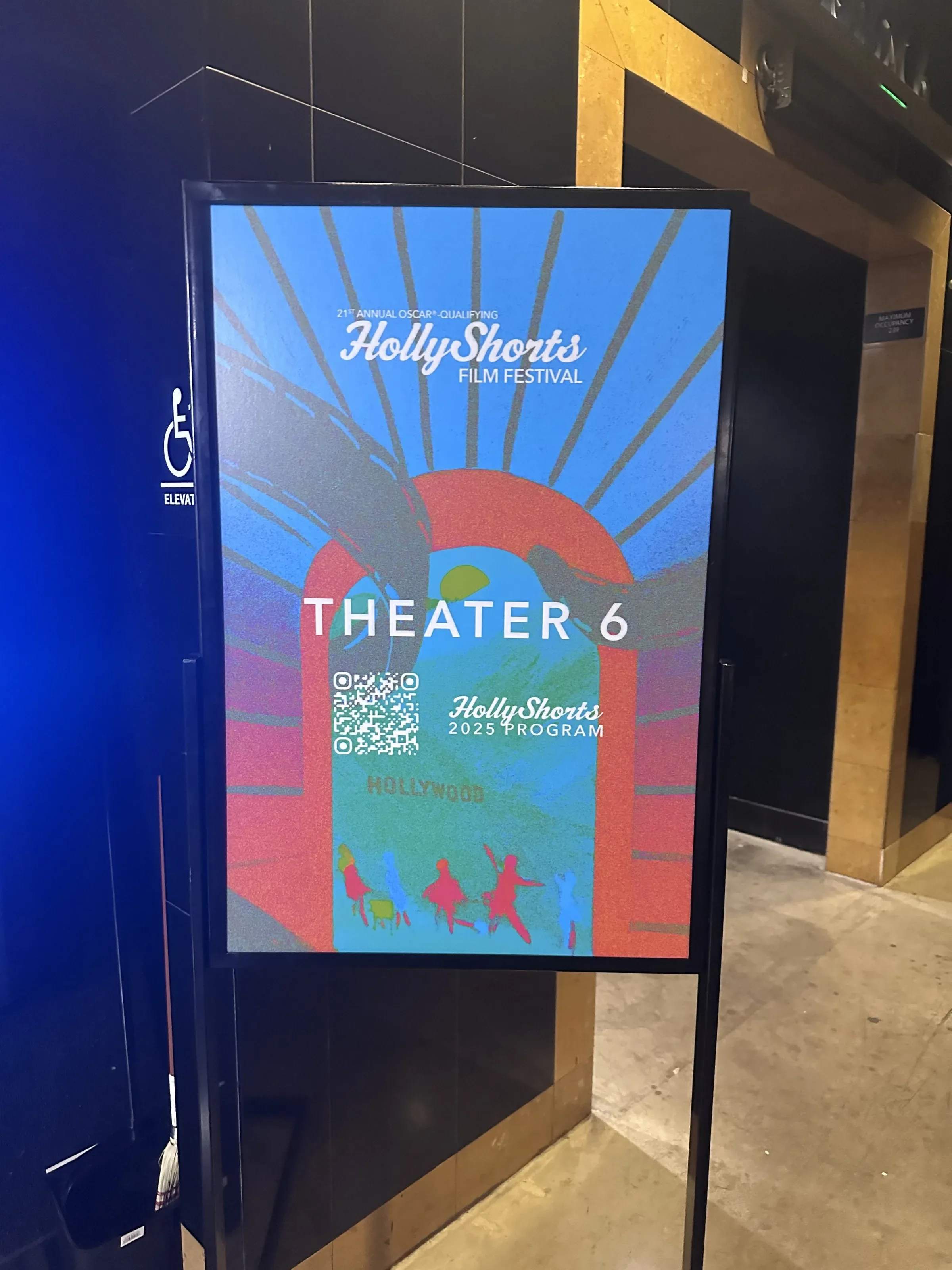 Theater 6 poster sign on a stand