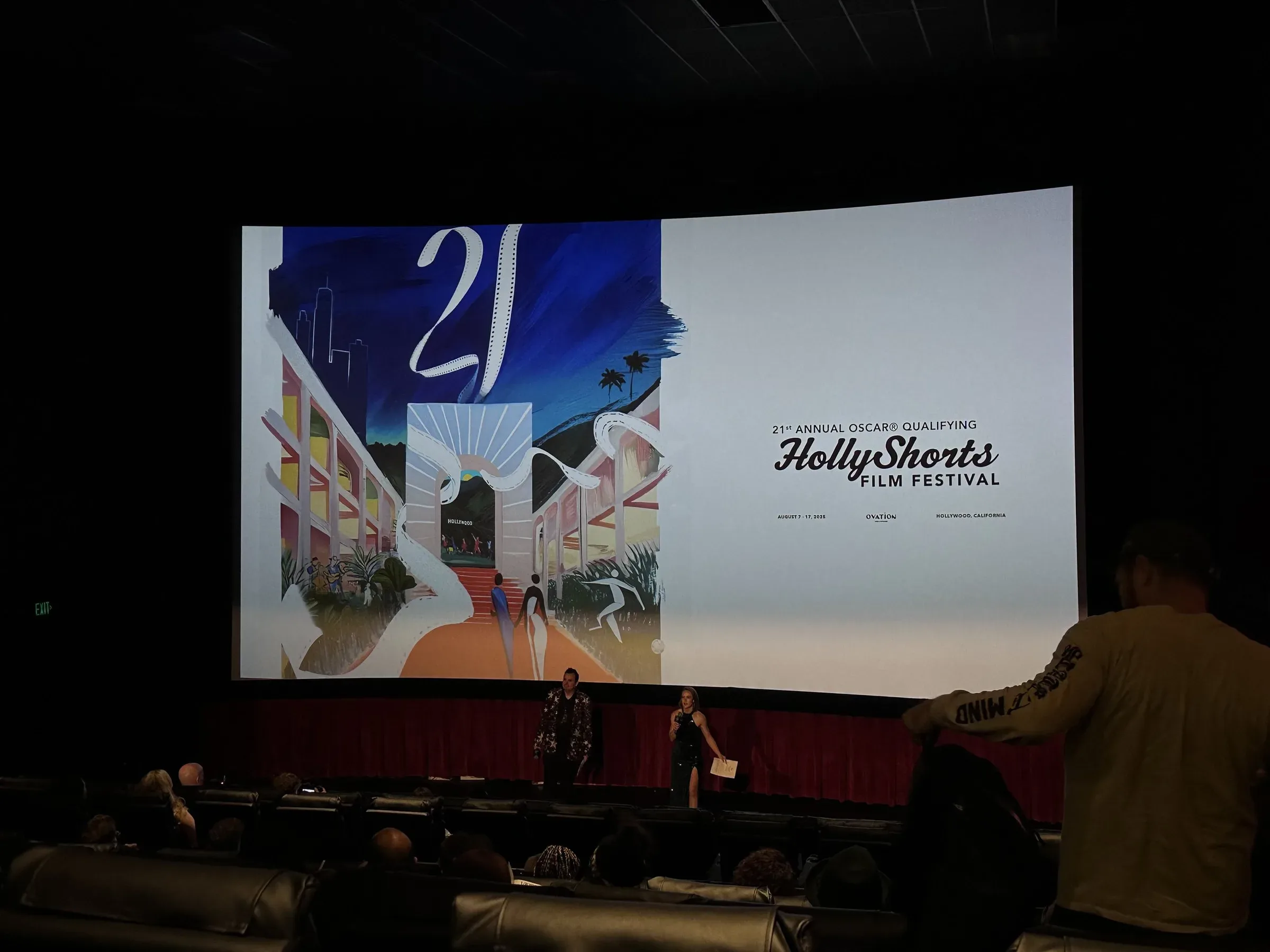 The poster art on the theater screen before a program.