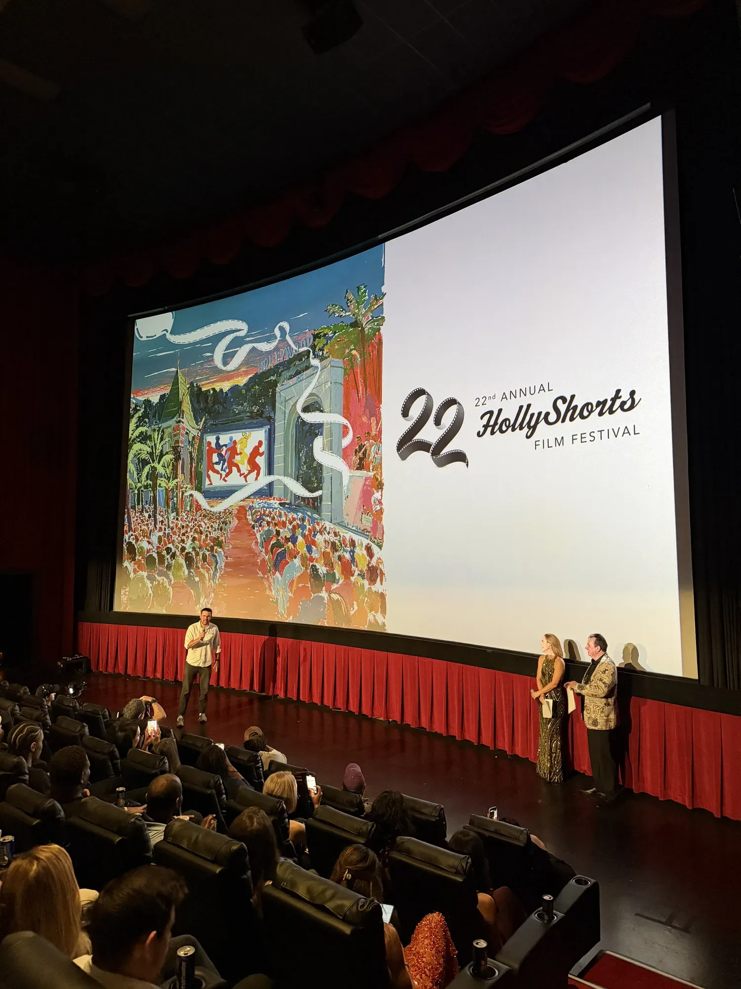 The 22 and the poster on the theater screen at the award show.