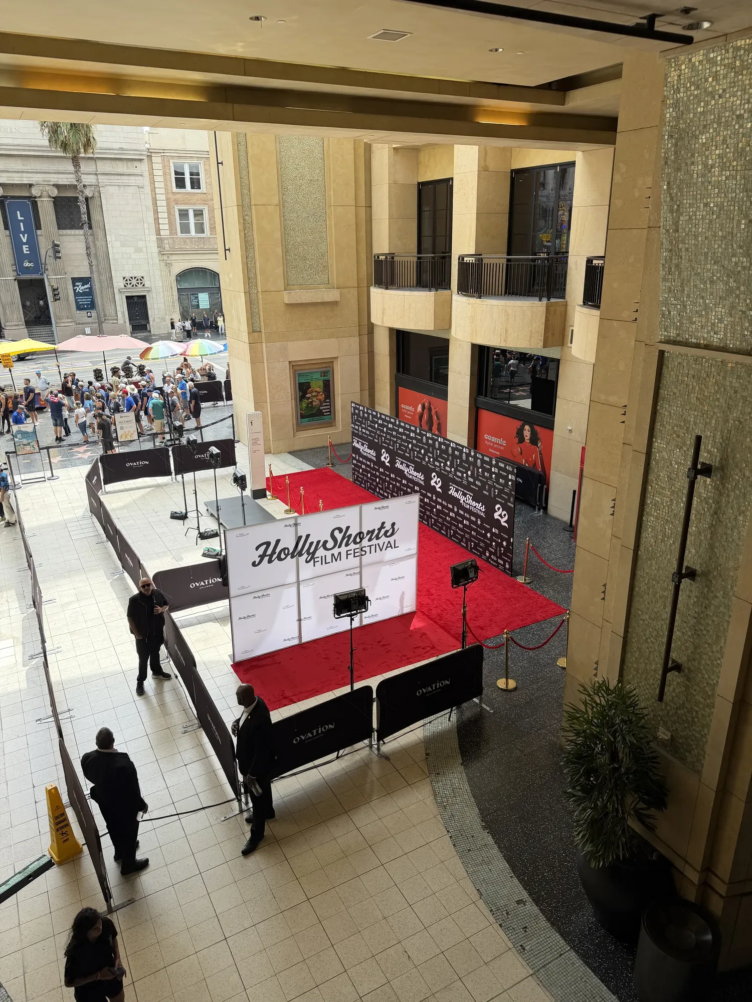 The red carpet and step-and-repeat seen from the balcony above.
