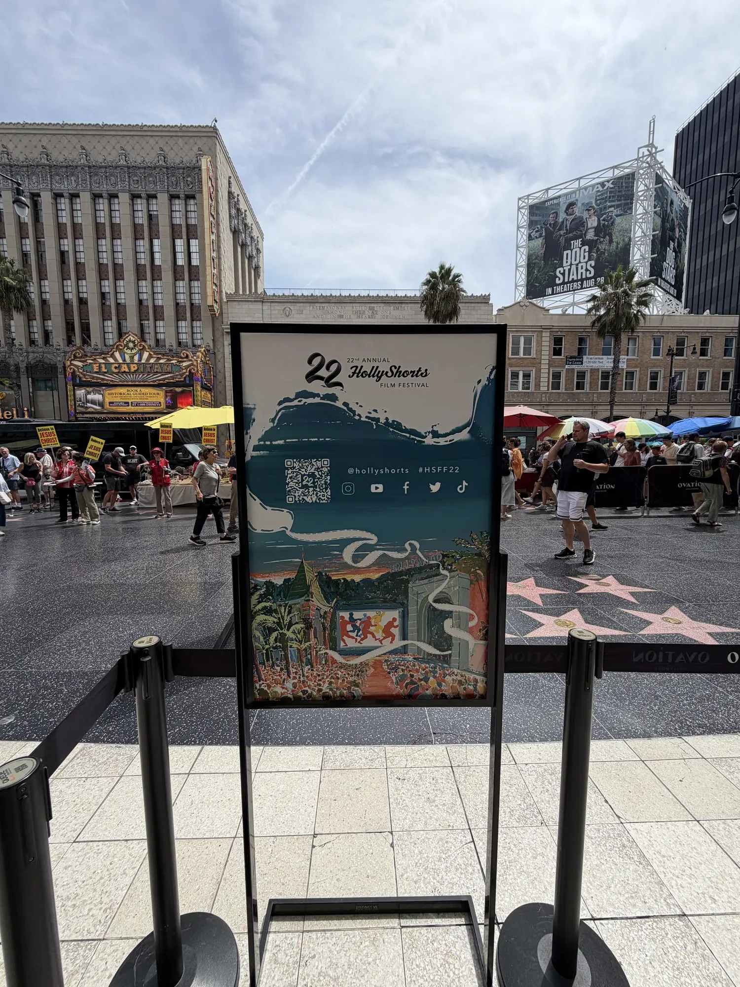 A Red Carpet sign with the festival figures on Hollywood Boulevard
