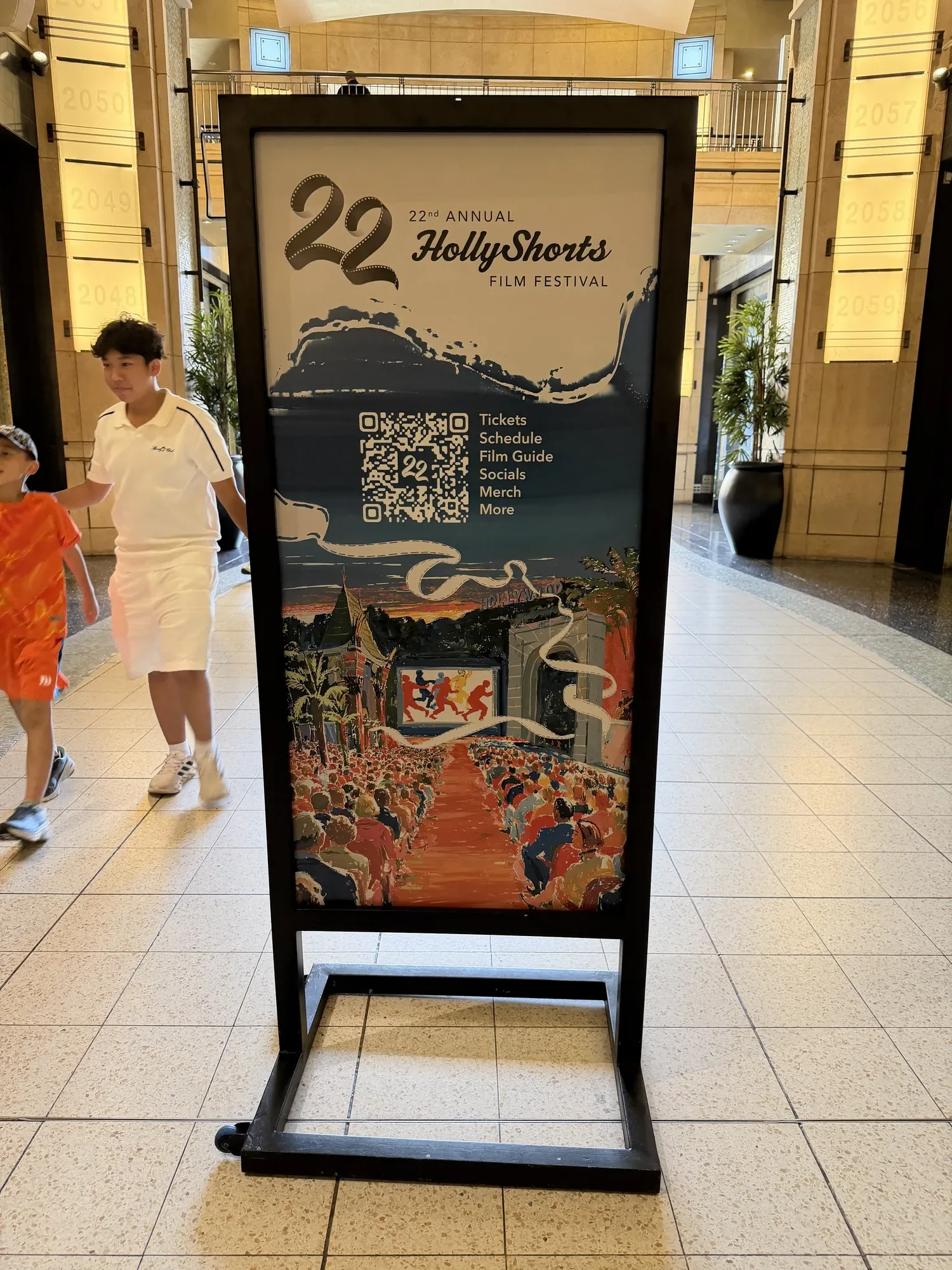 A HollyShorts 22 tower sign in the Ovation Hollywood walkway