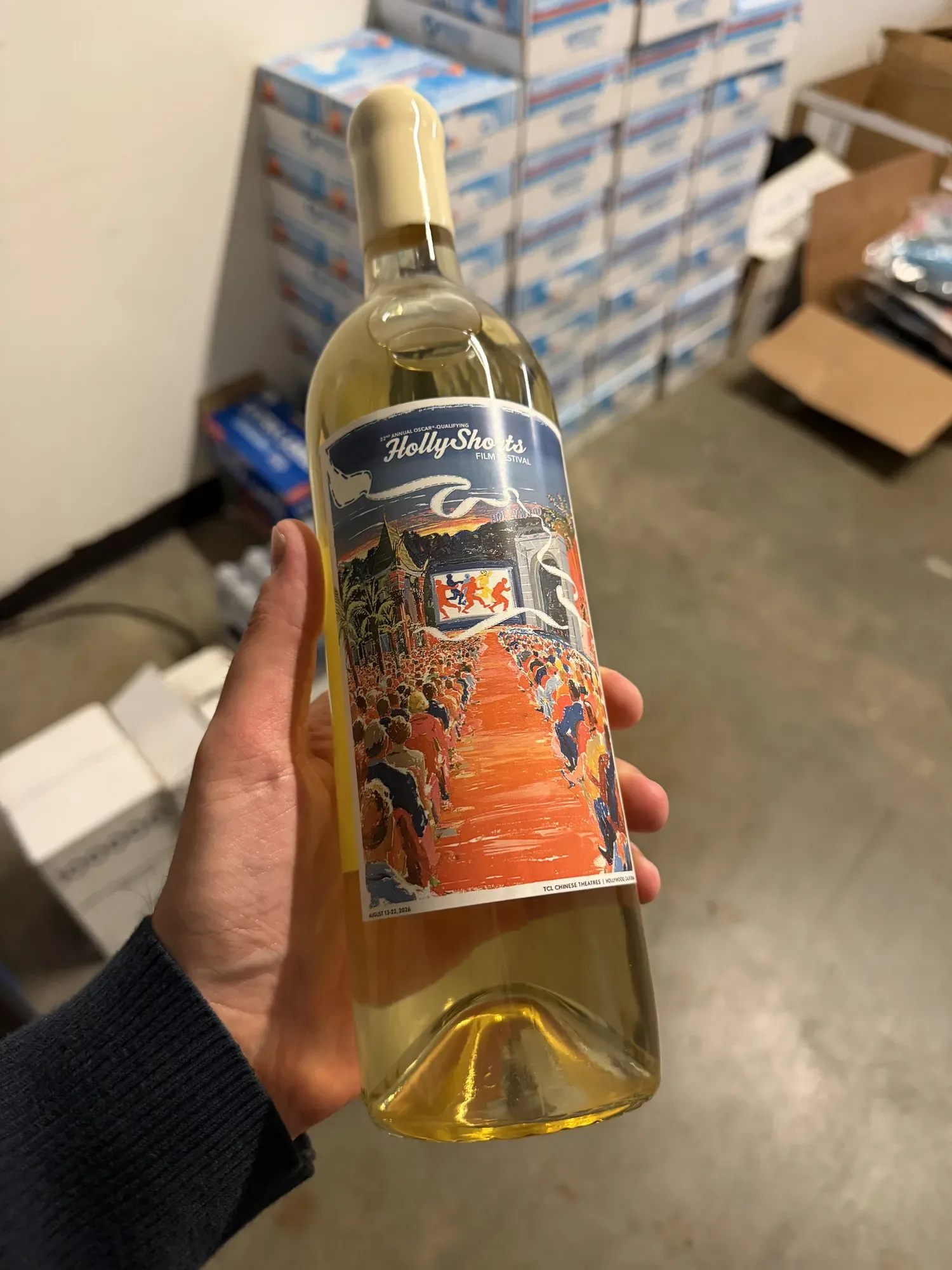 The white wine held in the hand, HollyShorts 22 label