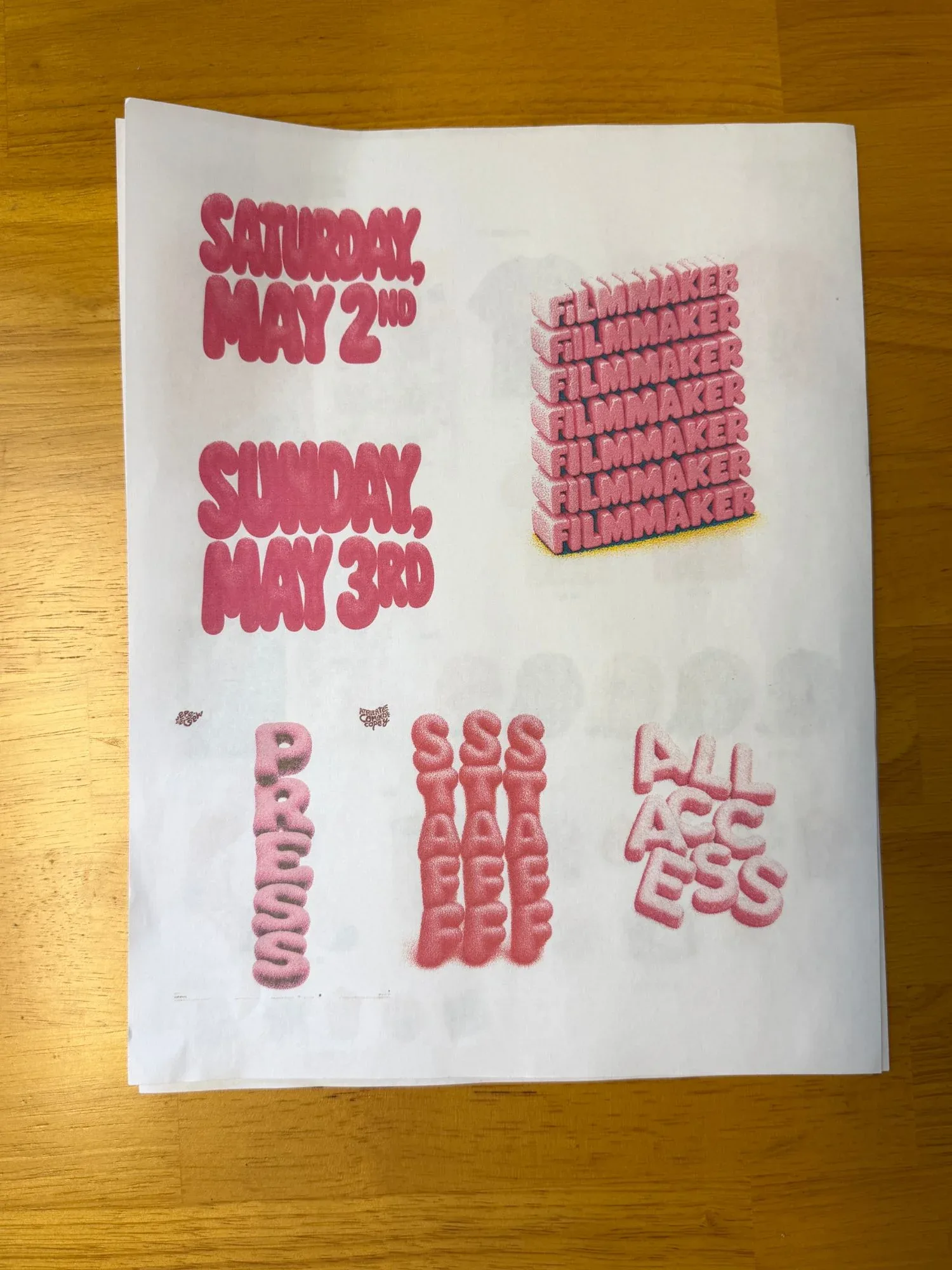 Printed type studies on the desk: the Saturday and Sunday dates in inflated letters.