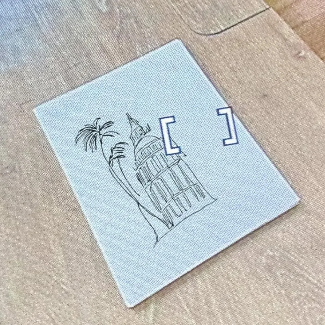 A drawing of the tower on blue grid paper, marked with crop brackets.