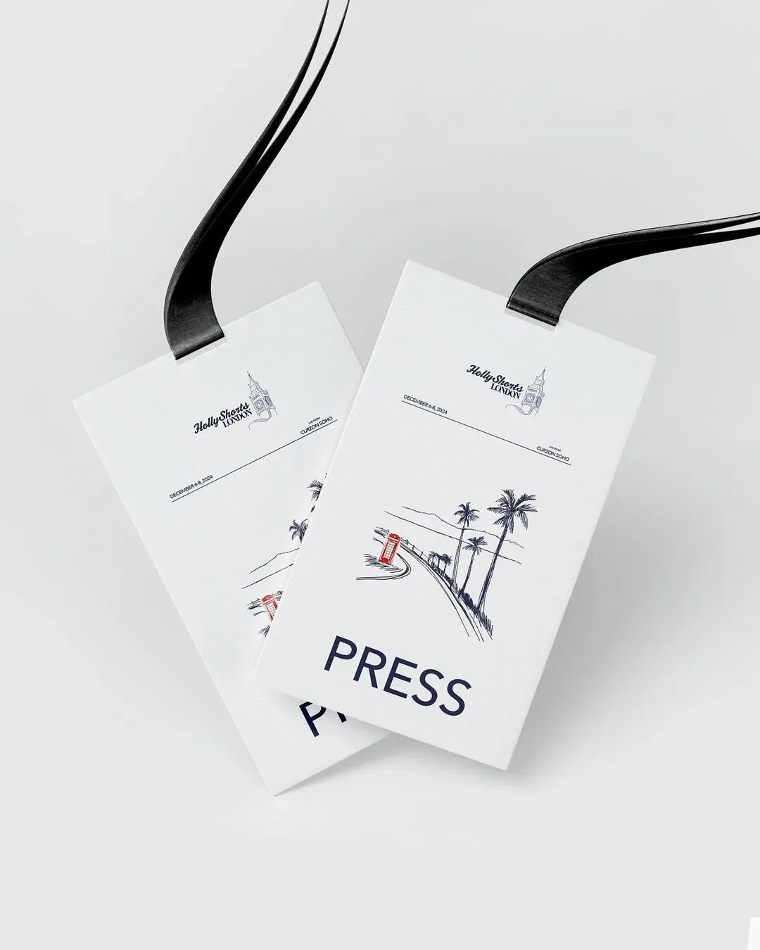 Press badges with line drawings of figures.
