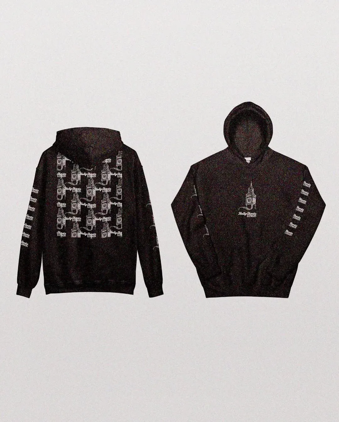 Two black hoodies printed with the drawn clock tower and a figure pattern.