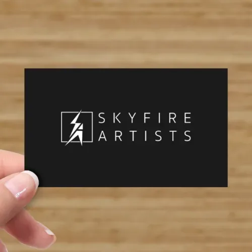 Mockup: a black business card in the hand.