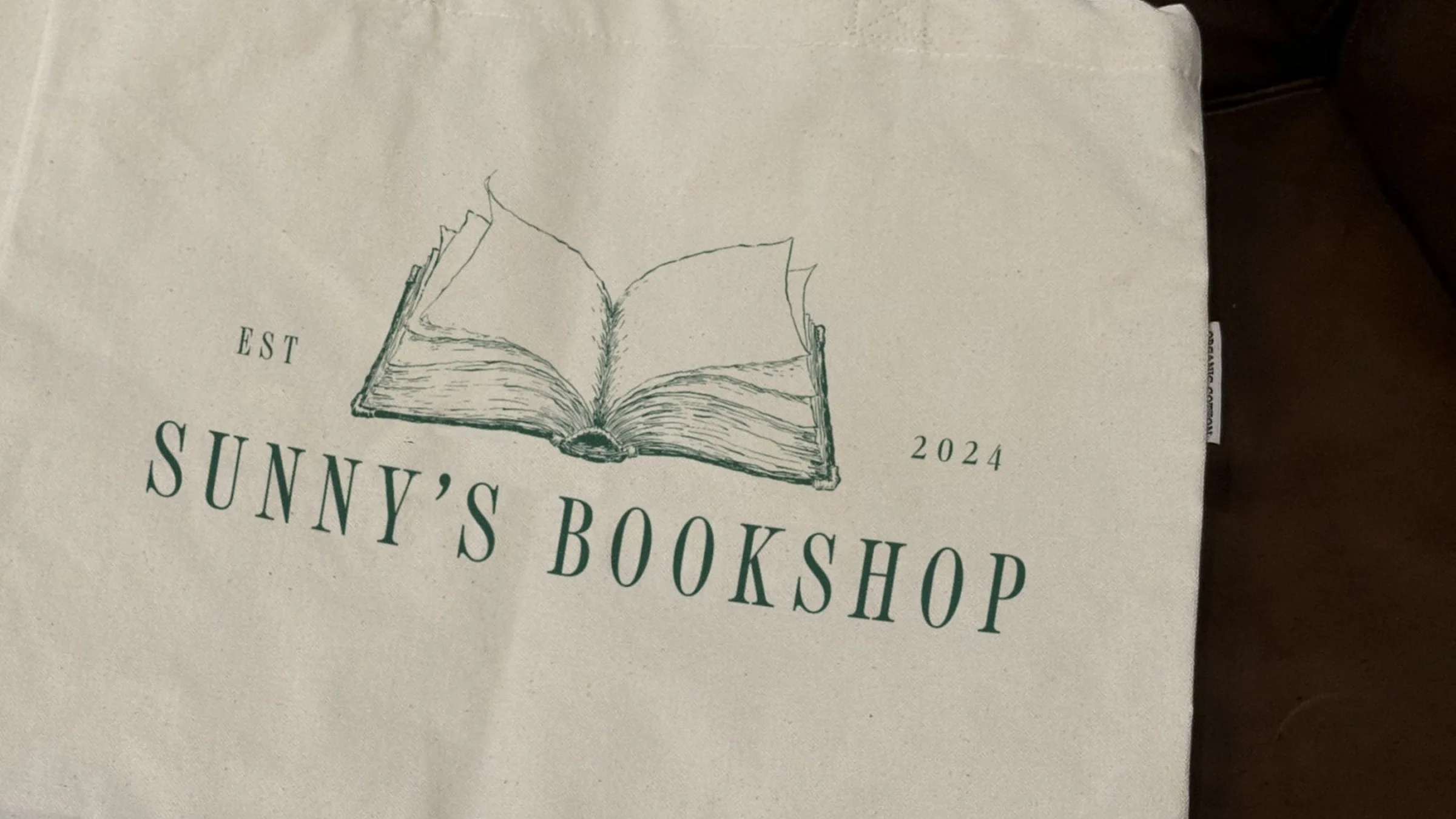 A canvas tote printed with the horizontal logo.