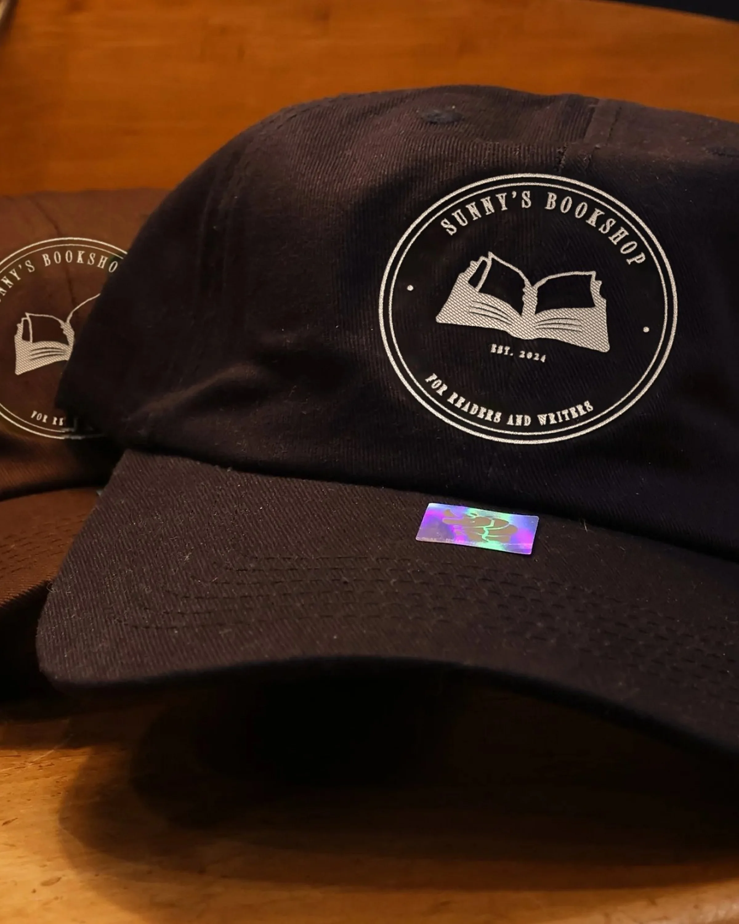 A navy cap embroidered with the seal.
