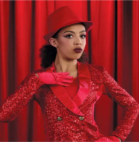 Broadway category tile: performer in shimmering red sequined dress