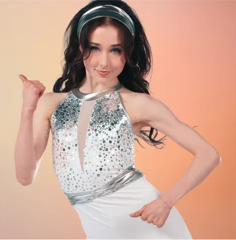 Groovy category tile: dancer in white sequined top with black wide-leg pants